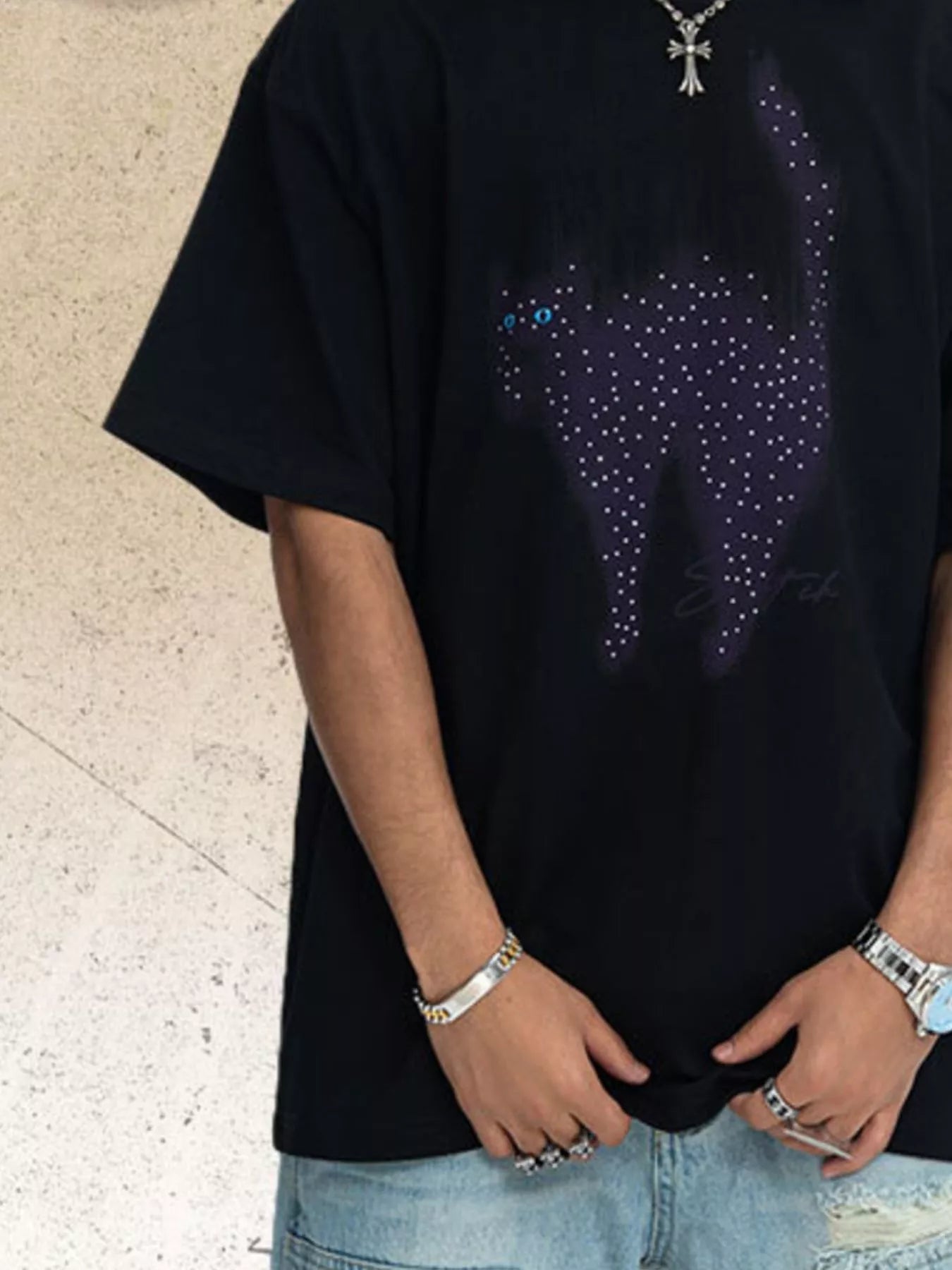 White men's short sleeve T-shirt by Trendsi featuring a playful cat graphic on the front.