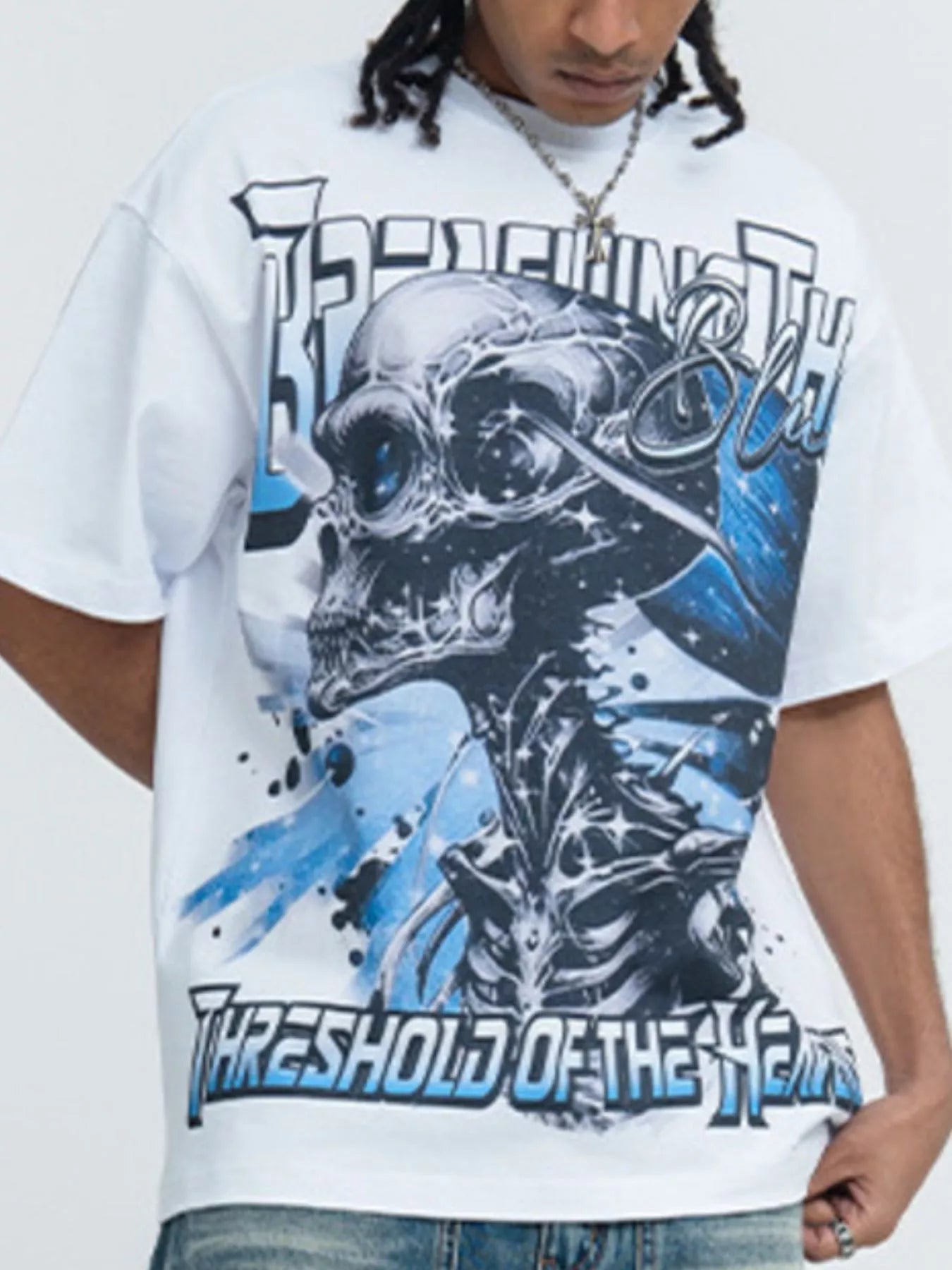 White men's skull graphic round neck T-shirt by Trendsi, featuring a bold skull design on soft, comfortable fabric.