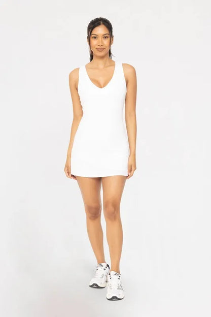 White MONO B adjustable active A-line dress by Trendsi, featuring a fitted waist and sleeveless design for a casual, sporty look.