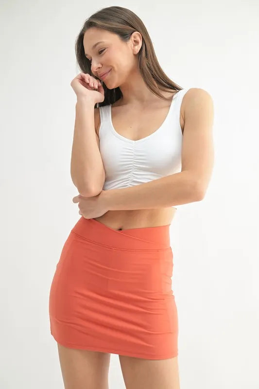 White MONO B ruched front active tank top, casual sleeveless workout top with a fitted silhouette, perfect for activewear.