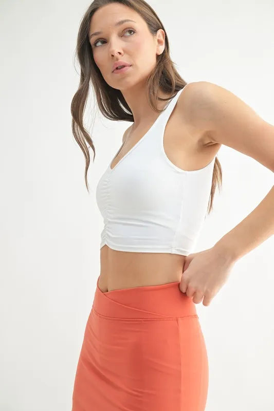 White MONO B ruched front active tank top, sleeveless athletic wear, styled for workout or casual activities.