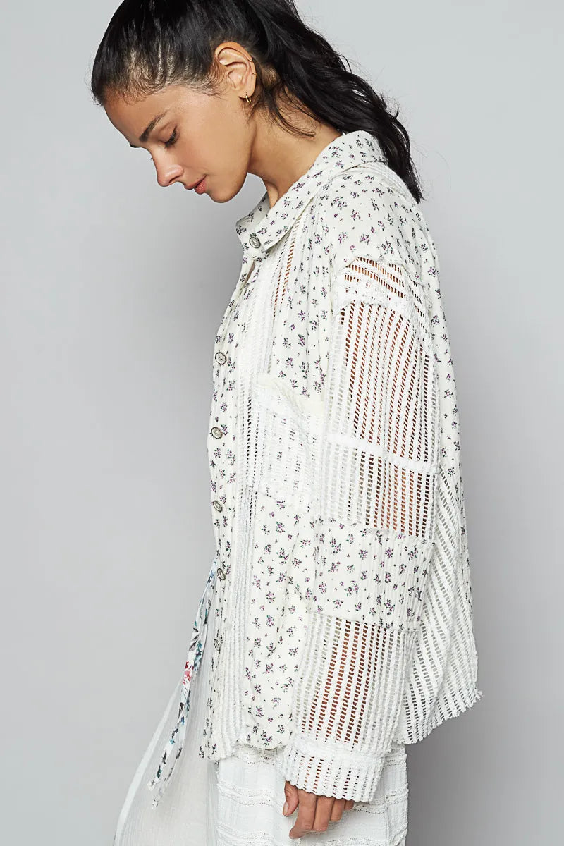 White floral crochet patchwork long sleeve shirt by Trendsi, featuring intricate crochet details and a relaxed fit.