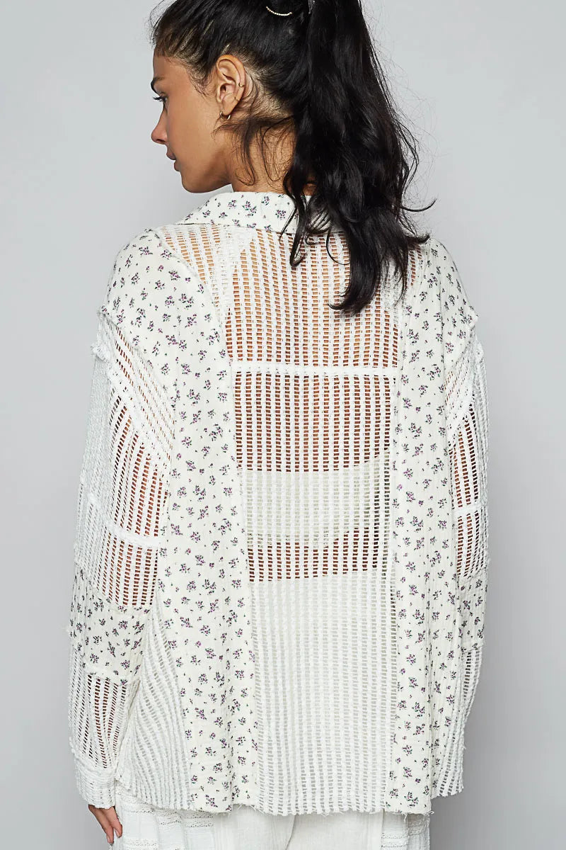 White floral crochet patchwork long sleeve shirt by Trendsi featuring intricate floral embroidery and a relaxed fit.