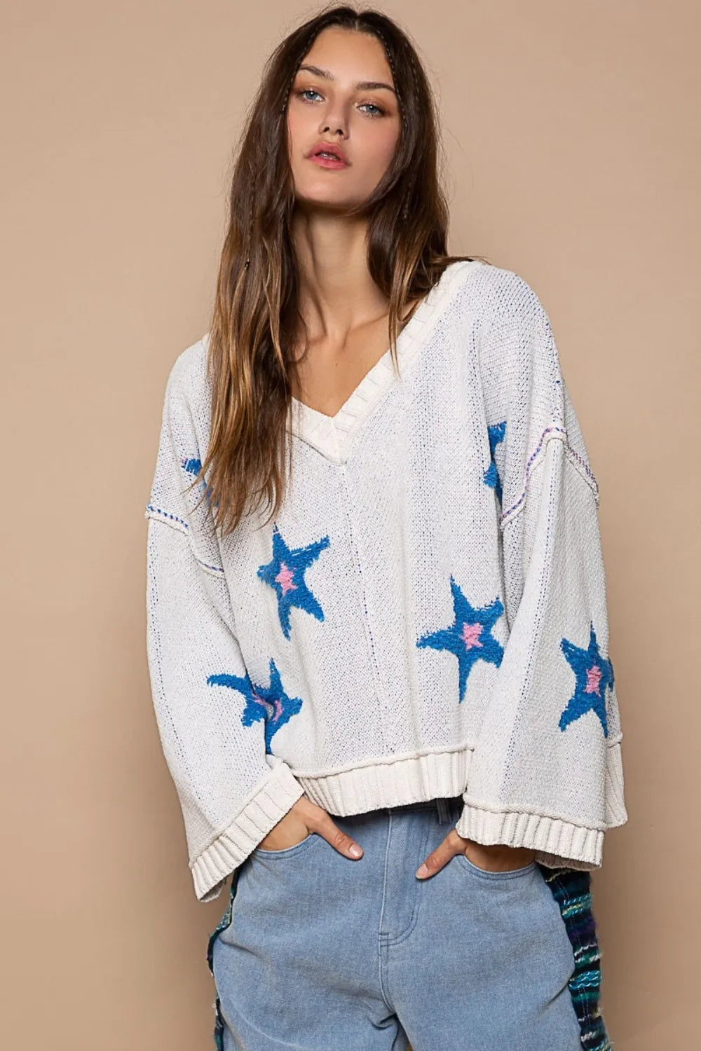 White POL Long Sleeve Star Patch Sweater by Trendsi featuring a cozy knit with star patches on the front.