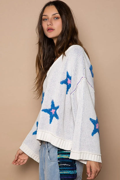 White POL long sleeve star patch sweater from Trendsi featuring a cozy knit fabric and stylish star patch details.