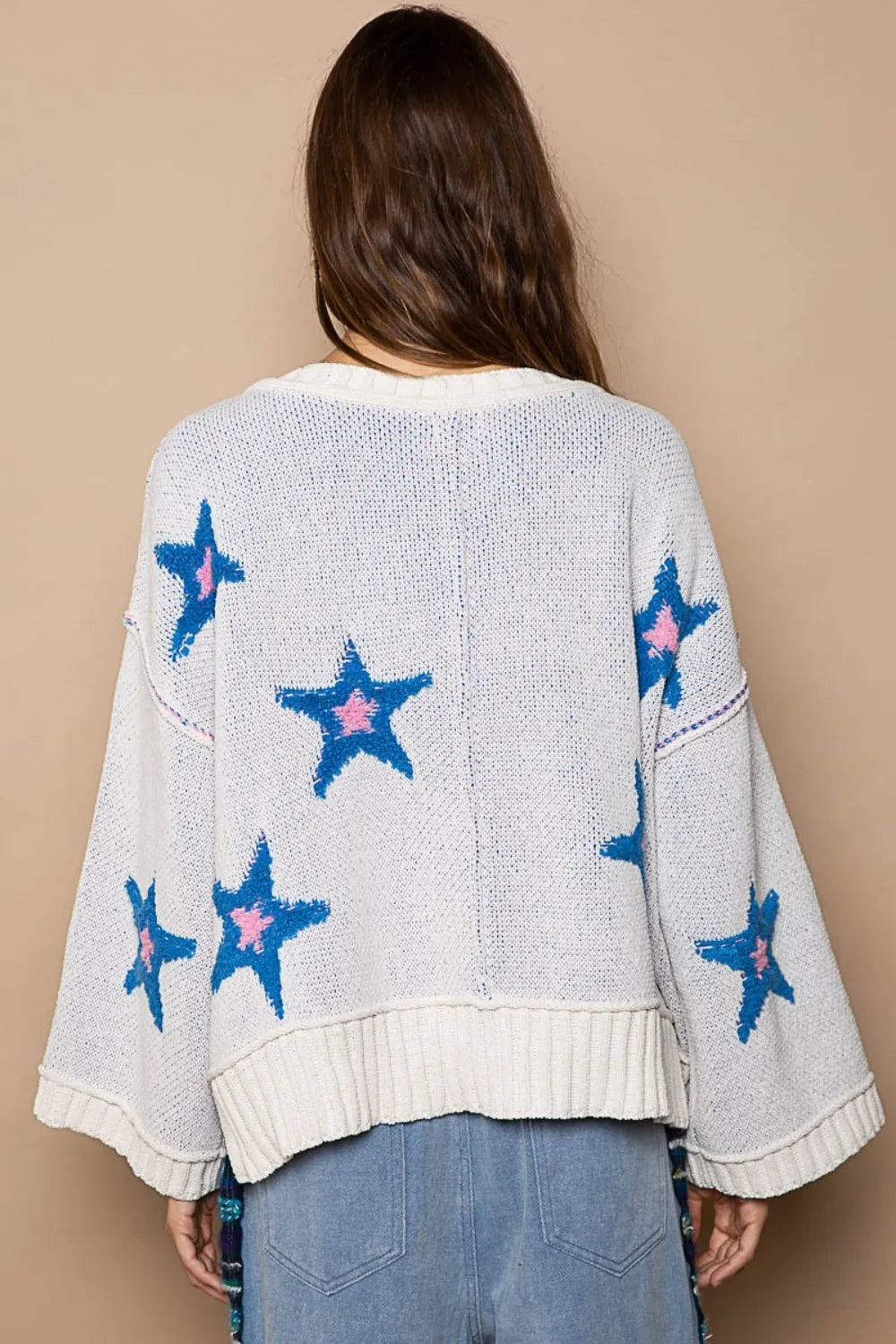 White POL long sleeve star patch sweater by Trendsi featuring a cozy knit design and star patches on the front.