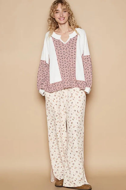 White POL waffle knit floral notched long sleeve top from Trendsi, featuring a cozy knit fabric and feminine floral design.