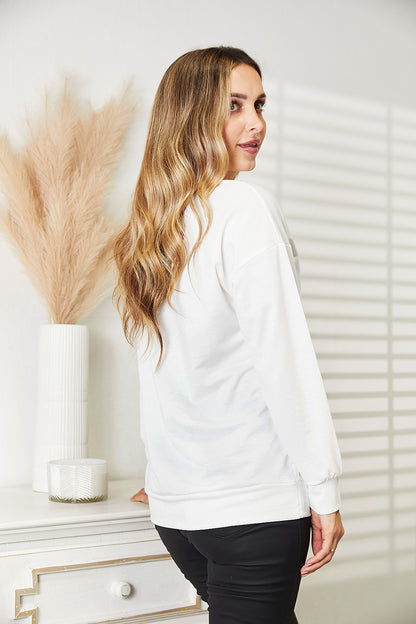 White Simply Love graphic dropped shoulder round neck sweatshirt by Trendsi, casual style with relaxed fit and bold print design.