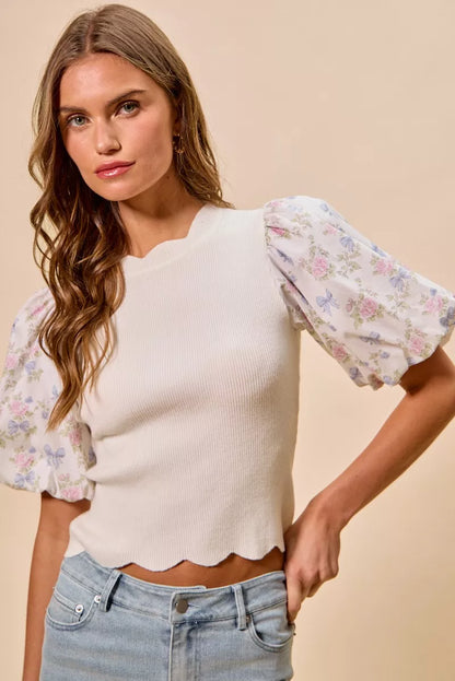 White floral cotton sweater top with contrast sleeves and scalloped edges by Trendsi, featuring a stylish and cozy design.