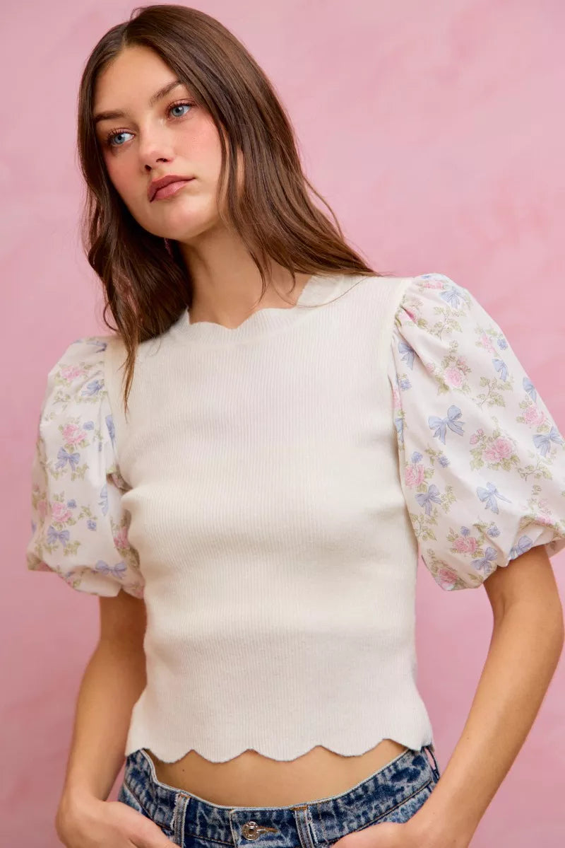 White floral cotton sweater top with contrast sleeves and scallop details, stylish and comfortable for casual wear.