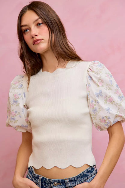 White floral cotton sweater top with contrast sleeves and scallop details, stylish and comfortable for casual wear.