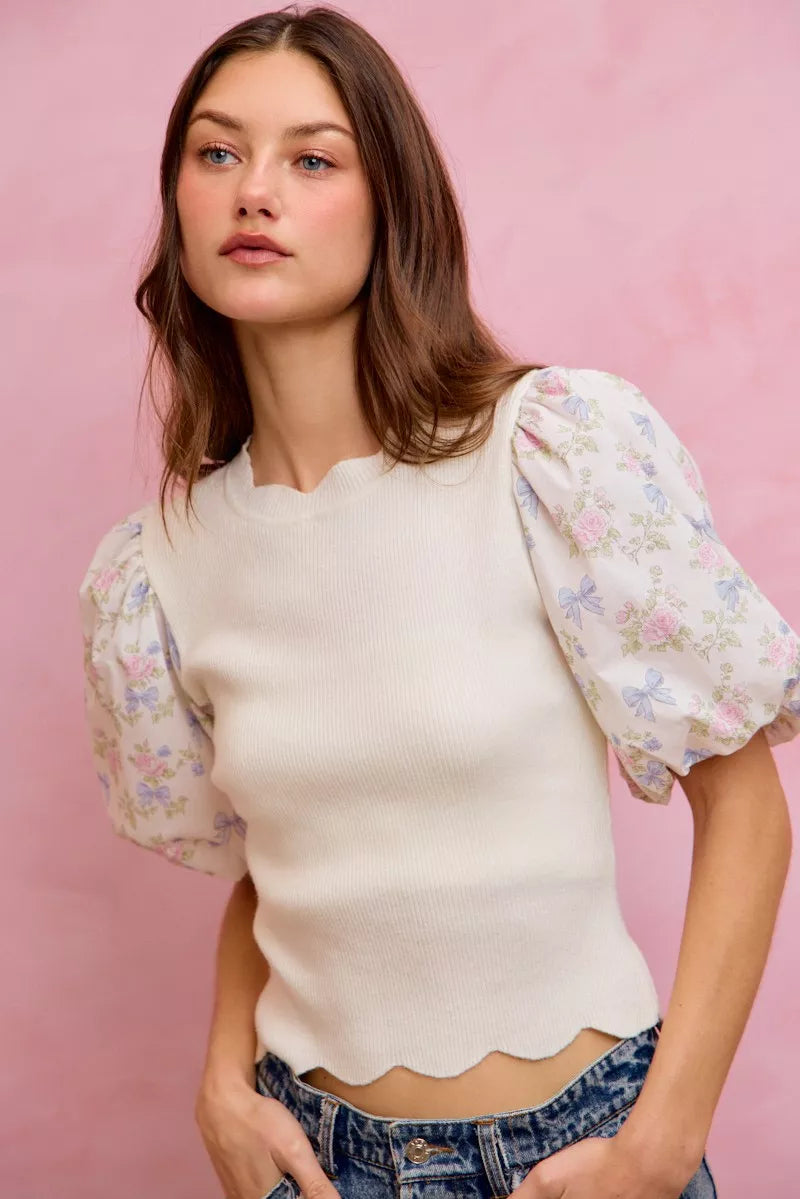 White floral cotton sweater top with contrast sleeves and scallop hem from Trendsi, stylish and comfortable for casual wear.