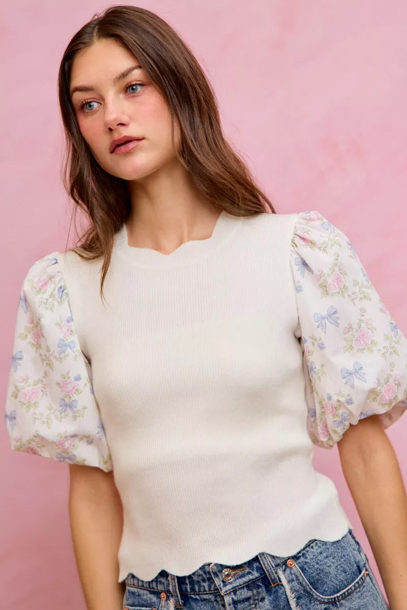 White floral cotton sweater top with contrast sleeves and scalloped hem, stylish and comfortable from Trendsi.