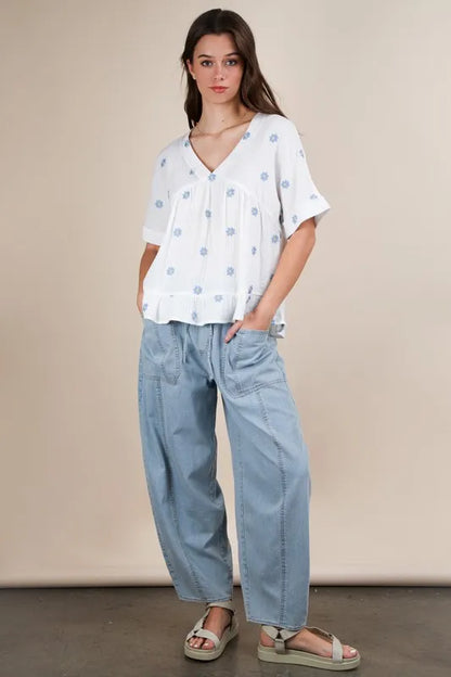 White Very J Flower embroidered woven blouse by Trendsi, featuring intricate floral embroidery and lightweight fabric.