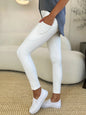 White Trendsi wide waistband sports leggings shown on a model, featuring a comfortable fit and stretchy fabric for activewear.