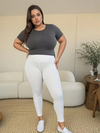 White wide waistband sports leggings by Trendsi, featuring a comfortable fit and stretchy fabric for active wear.