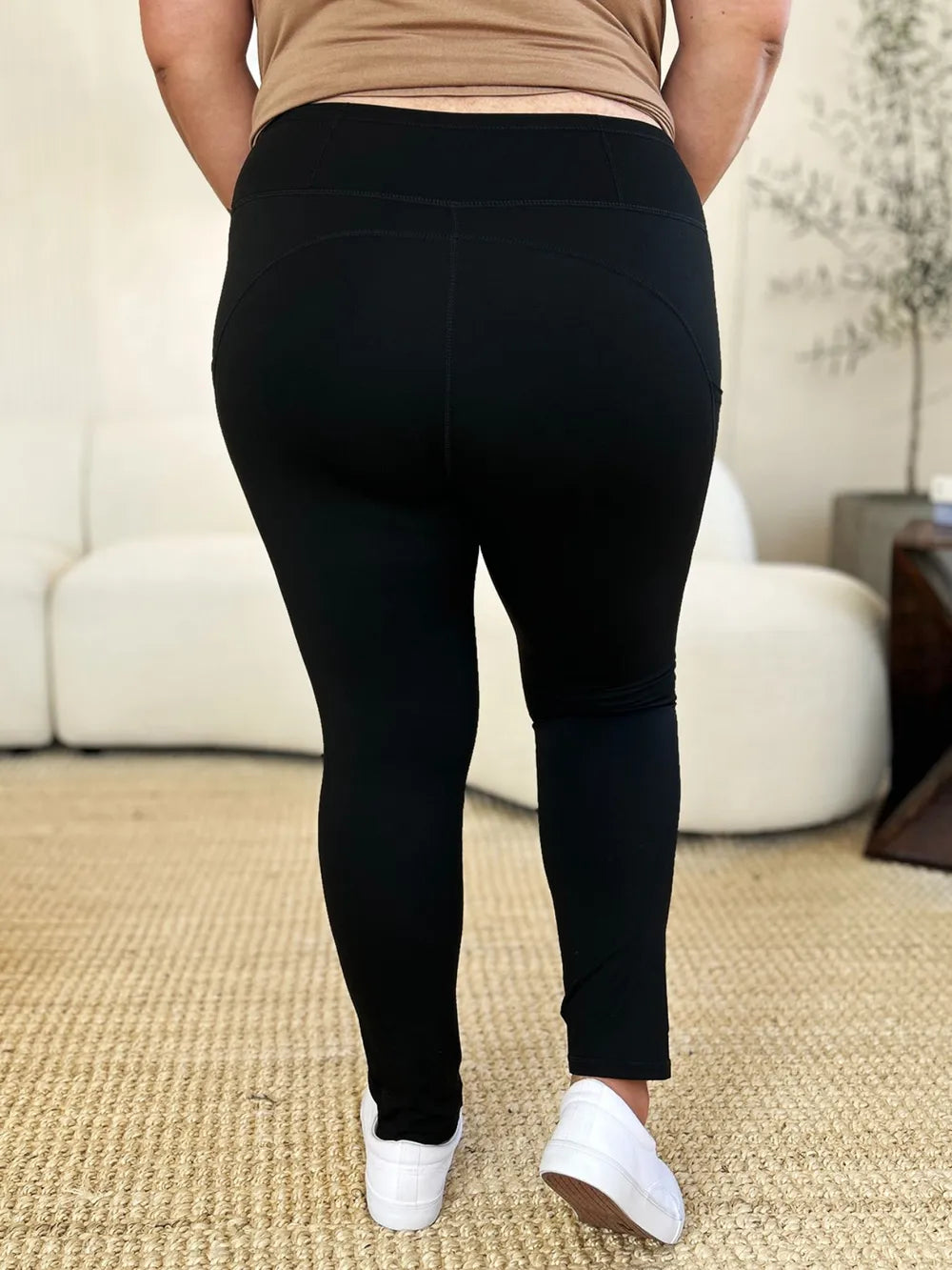 White wide waistband sports leggings by Trendsi, featuring a comfortable fit and sleek design for active wear.