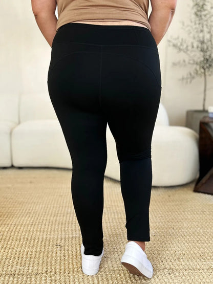 White wide waistband sports leggings by Trendsi, featuring a comfortable fit and sleek design for active wear.