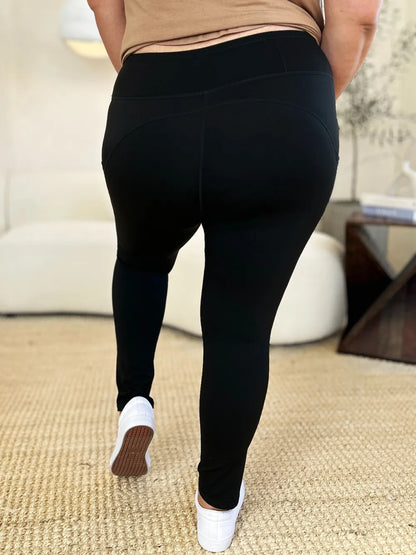 White wide waistband sports leggings by Trendsi, shown on a model, highlighting comfortable fit and stretchy athletic fabric.