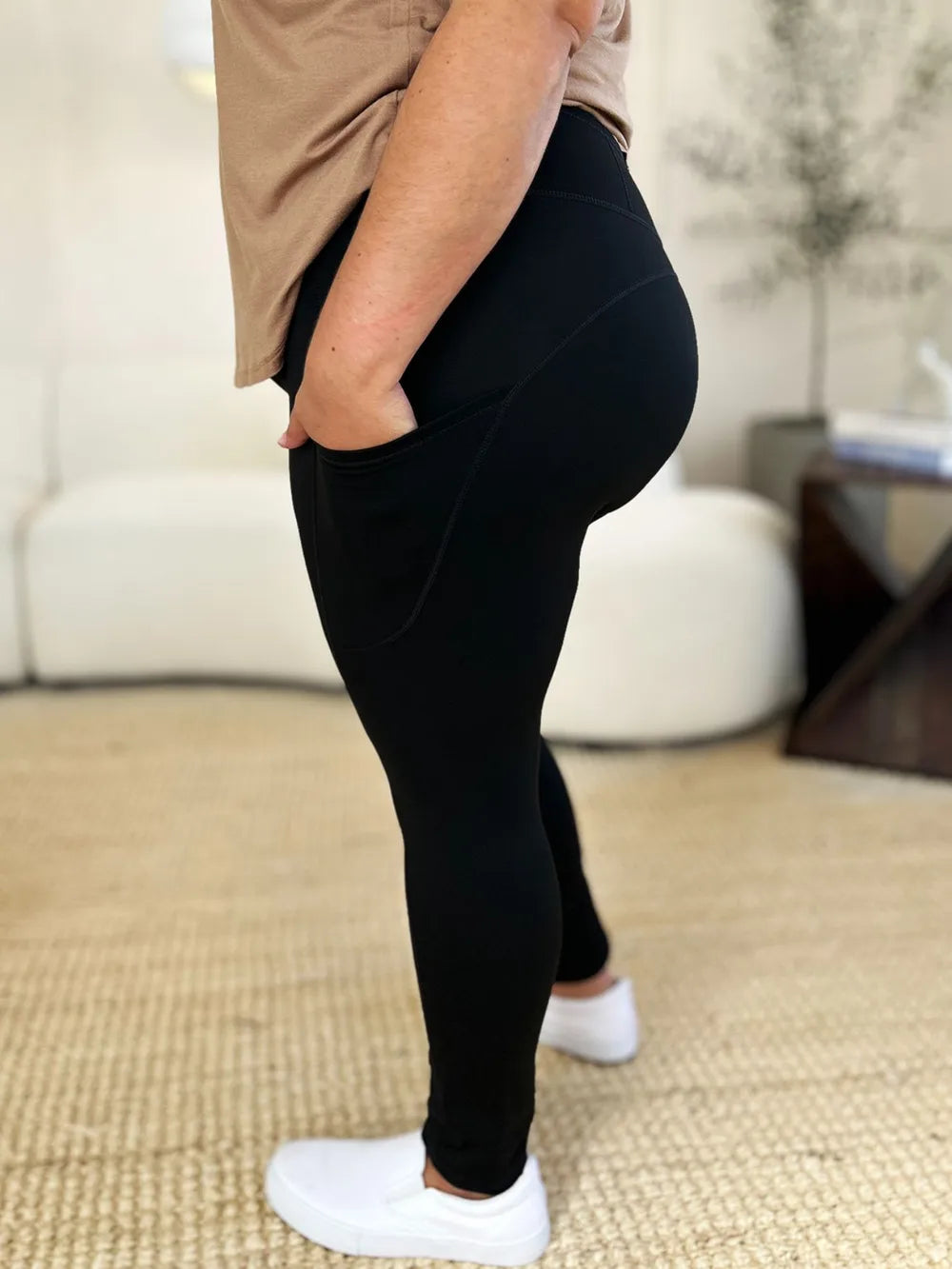 White Trendsi wide waistband sports leggings shown on a model, featuring a high-rise fit and stretchy fabric for active wear.