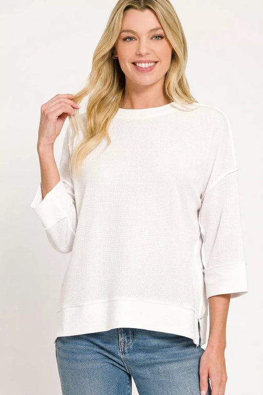 White Zenana double knit 3/4 sleeve top with a relaxed fit and subtle texture, designed for comfort and casual style.