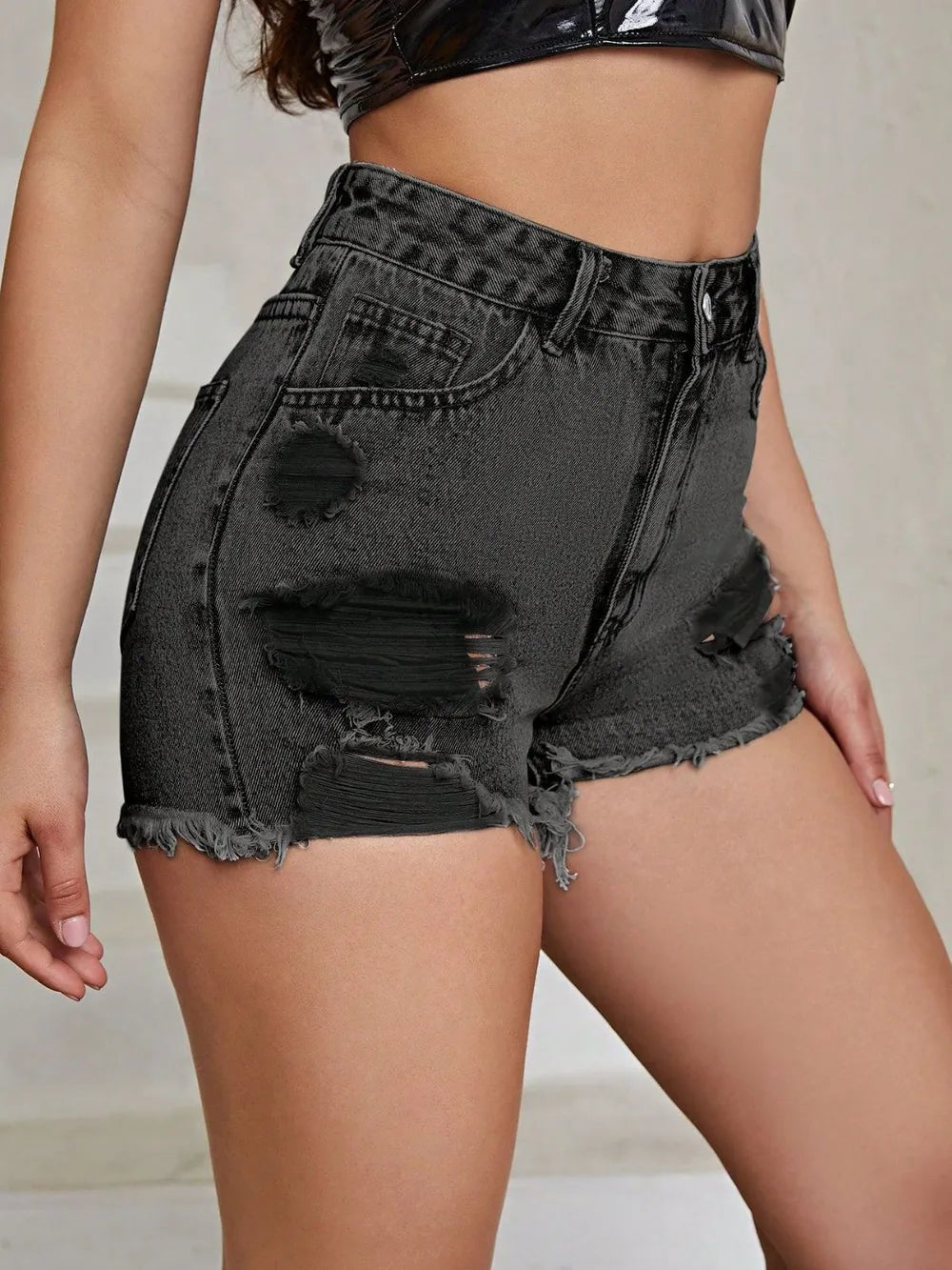 White distressed raw hem high-rise denim shorts from Trendsi, featuring a casual fit and classic denim style.