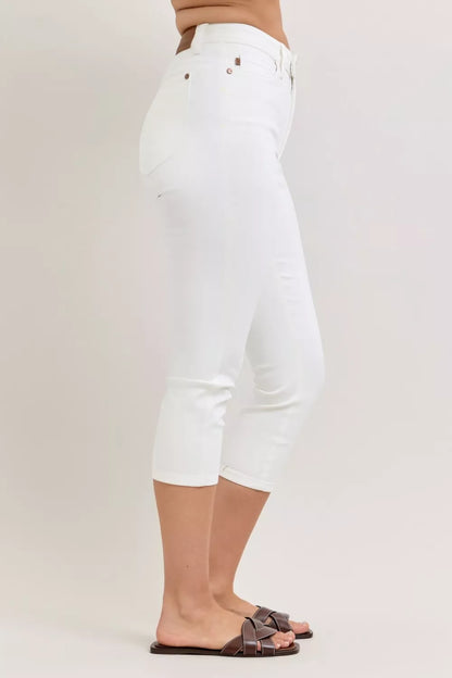 White Judy Blue high waist capri pants with extended waistband and spade pockets, displayed on a model.