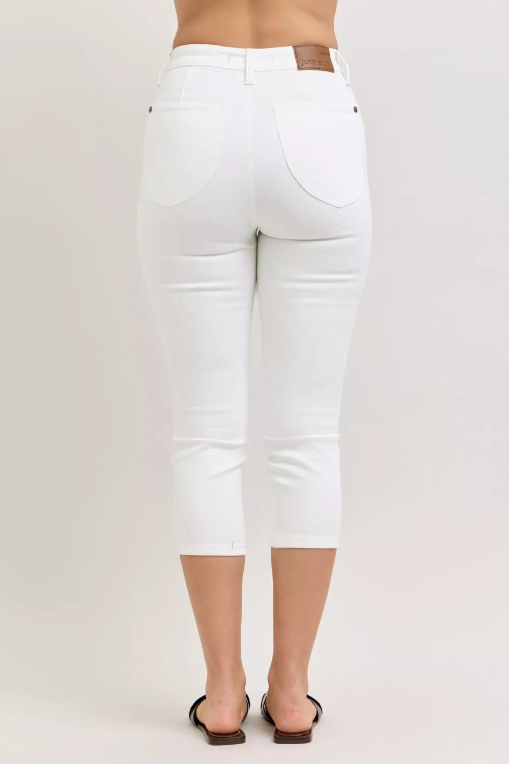 White Judy Blue high waist capri pants with extended waistband and spade pockets, stylish and comfortable for casual wear.