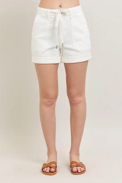 Plus size Judy Blue high waist cuff denim shorts with a classic five-pocket design and rolled-up hem, displayed on a white background.