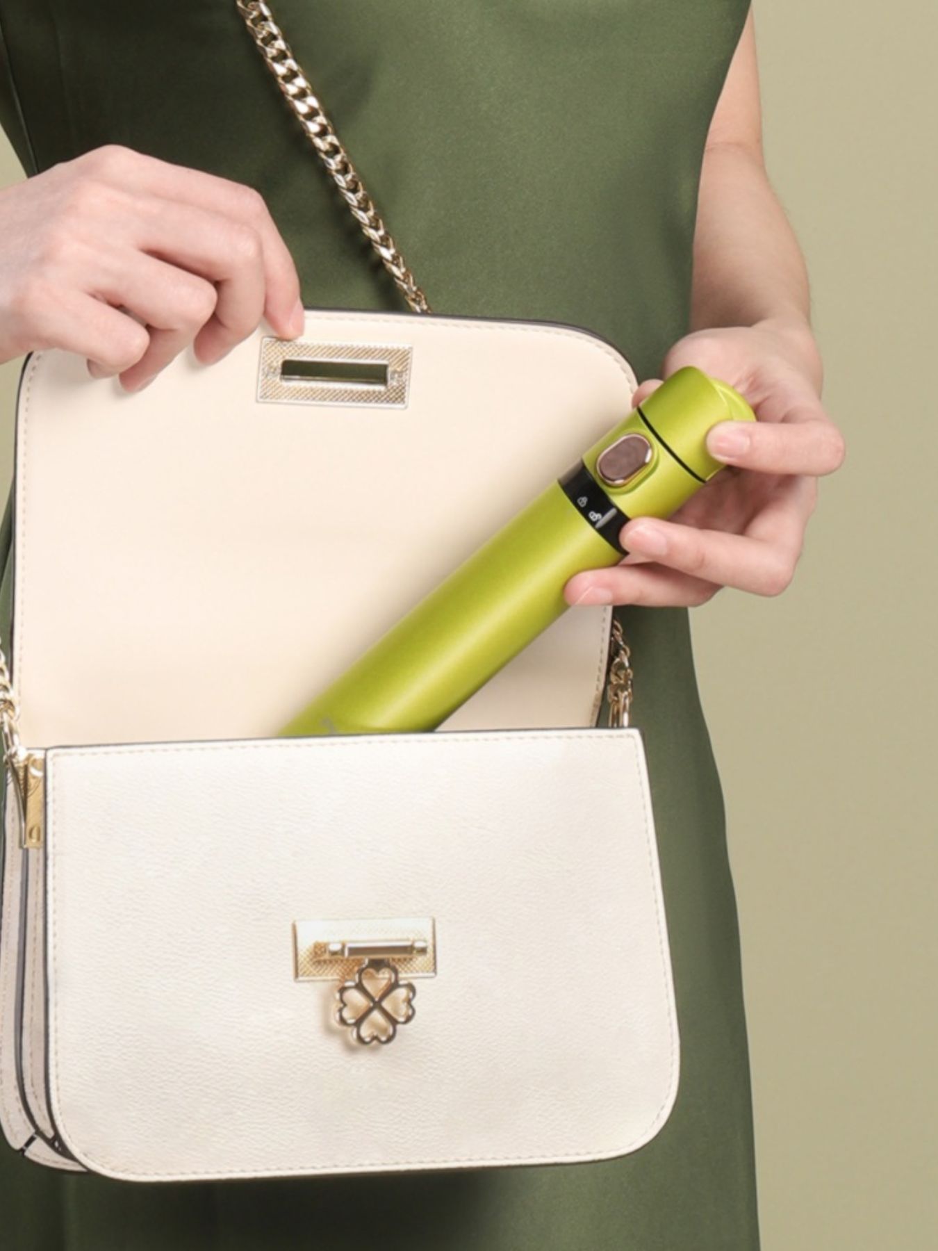 Yellow and green portable hair curling iron by Trendsi, compact design with a curling barrel for easy styling on the go.