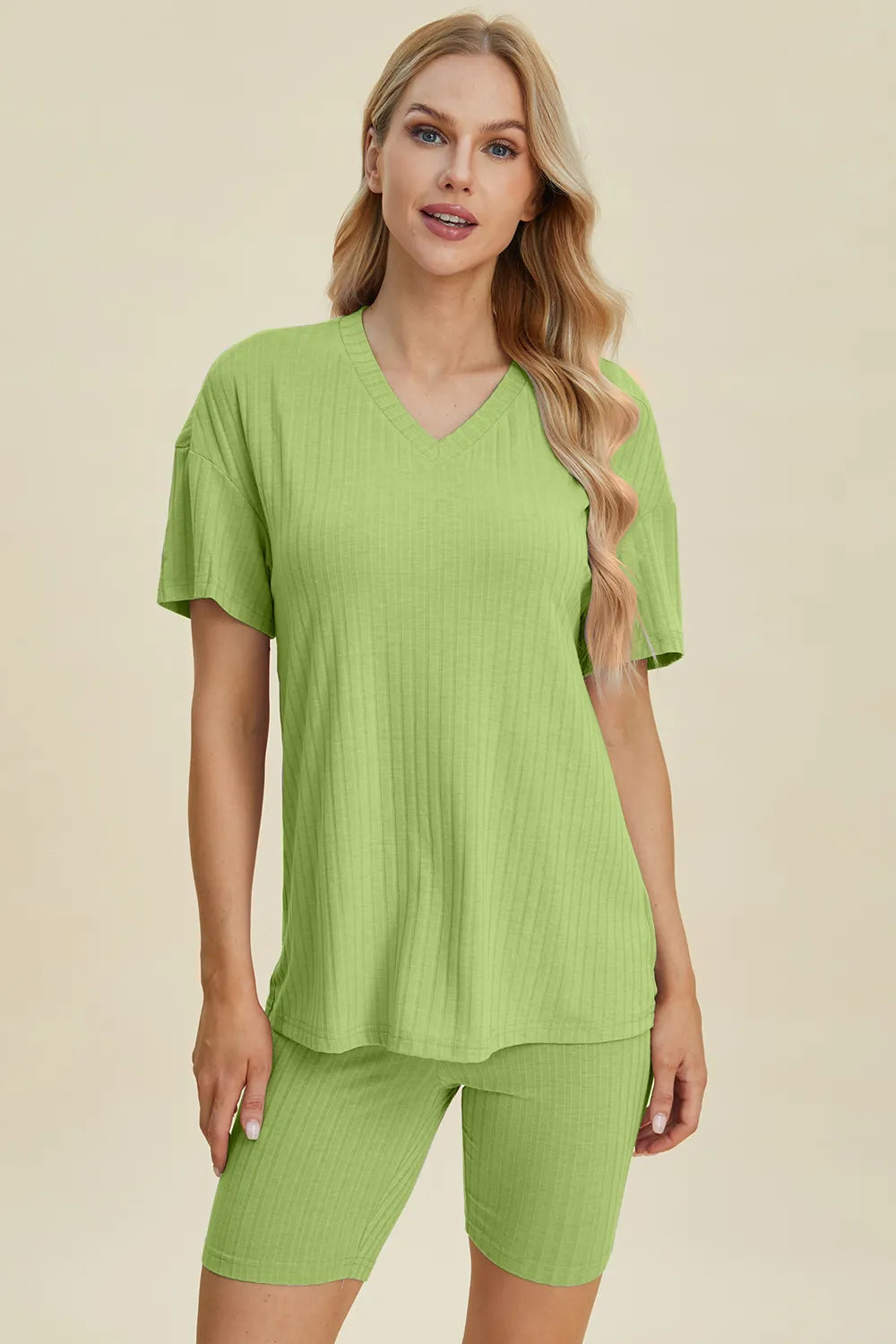 Yellow-green ribbed V-neck short sleeve top and matching shorts set by Trendsi, casual and comfortable loungewear.