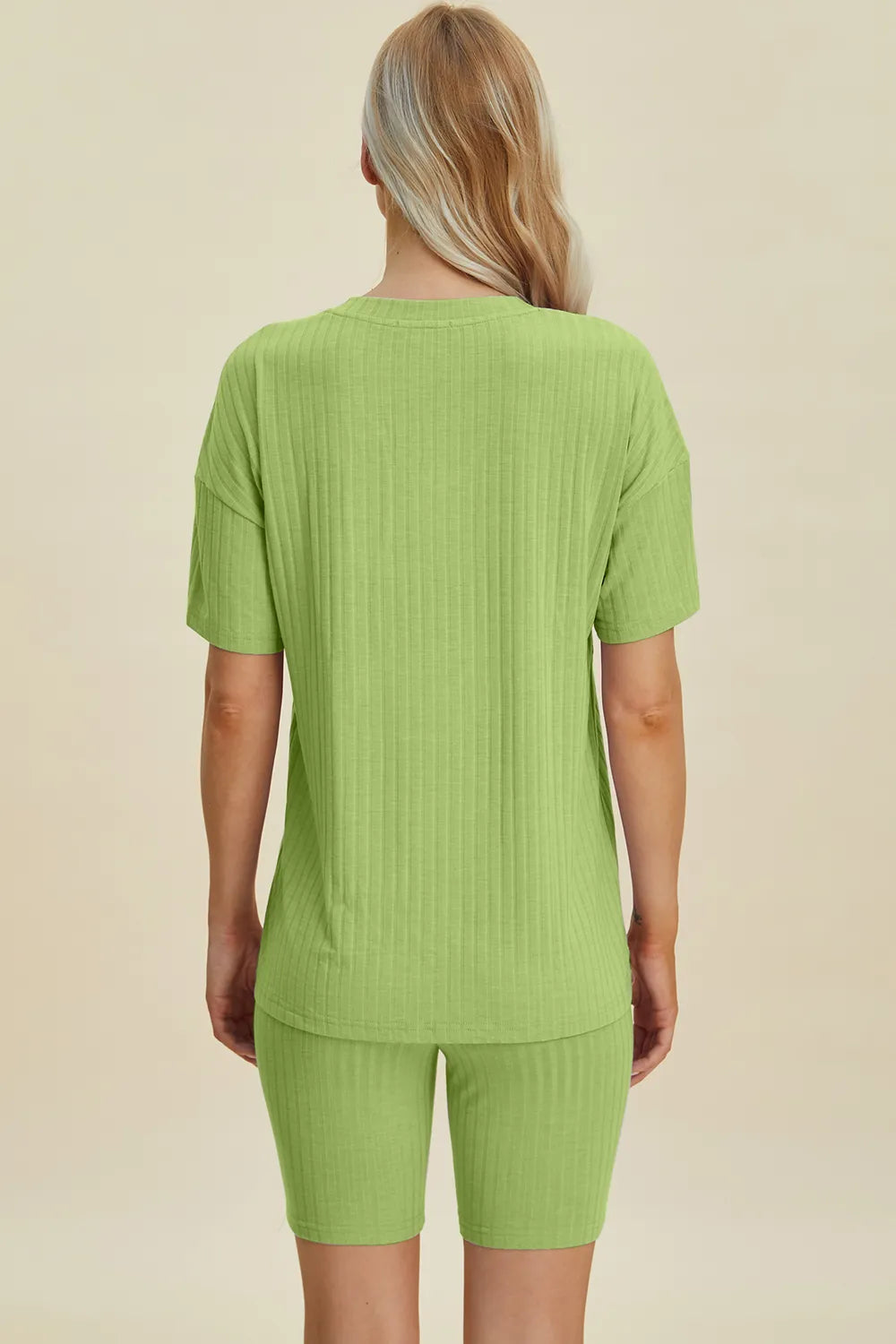 Yellow-green ribbed V-neck short sleeve top and matching shorts set by Trendsi, casual and comfortable for everyday wear.