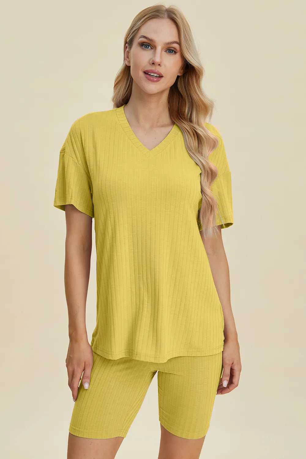 Yellow-green ribbed V-neck short sleeve top and matching shorts set by Trendsi, casual and comfortable summer outfit.