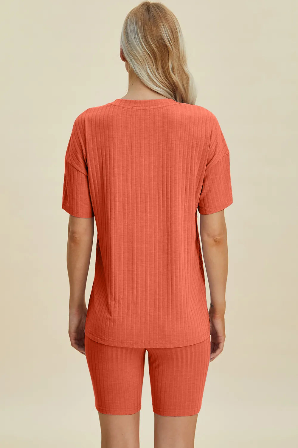 Yellow-green ribbed V-neck short sleeve top and matching shorts set by Trendsi, casual and comfortable women's clothing ensemble.
