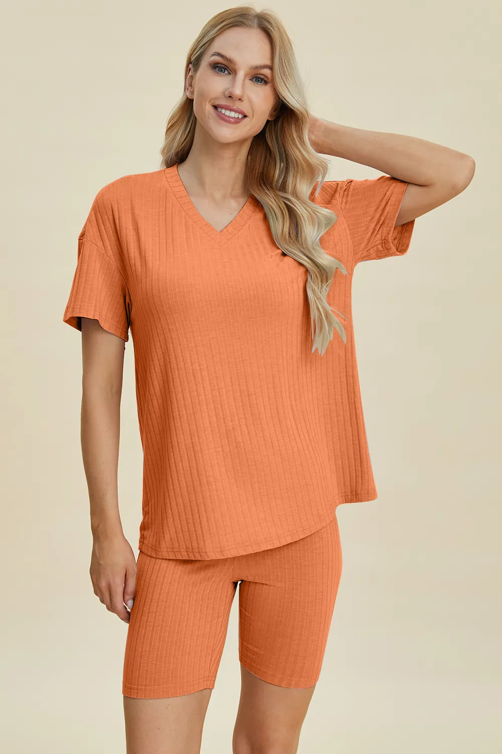 Yellow-green ribbed V-neck short sleeve top and matching shorts set by Trendsi, casual and comfortable for everyday wear.