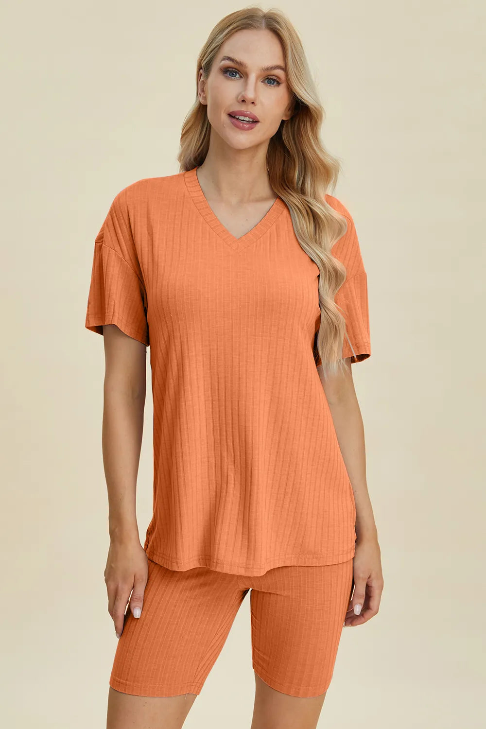 Yellow-green ribbed V-neck short sleeve top and matching shorts set by Trendsi, casual and comfortable for everyday wear.