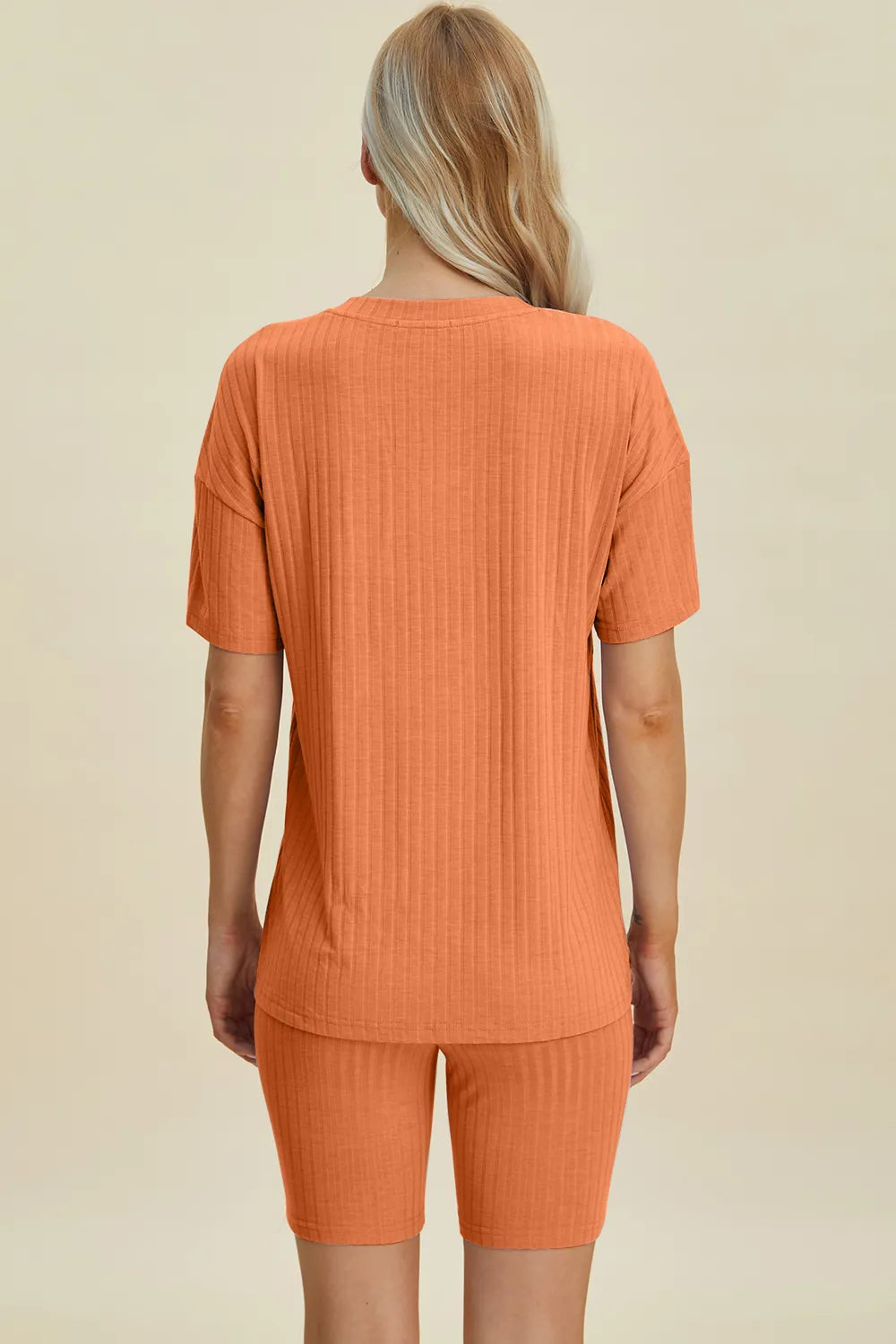 Yellow-green ribbed V-neck short sleeve top and matching shorts set by Trendsi, casual and comfortable full-size outfit.