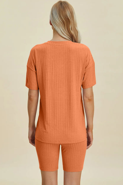 Yellow-green ribbed V-neck short sleeve top and matching shorts set by Trendsi, casual and comfortable full-size outfit.