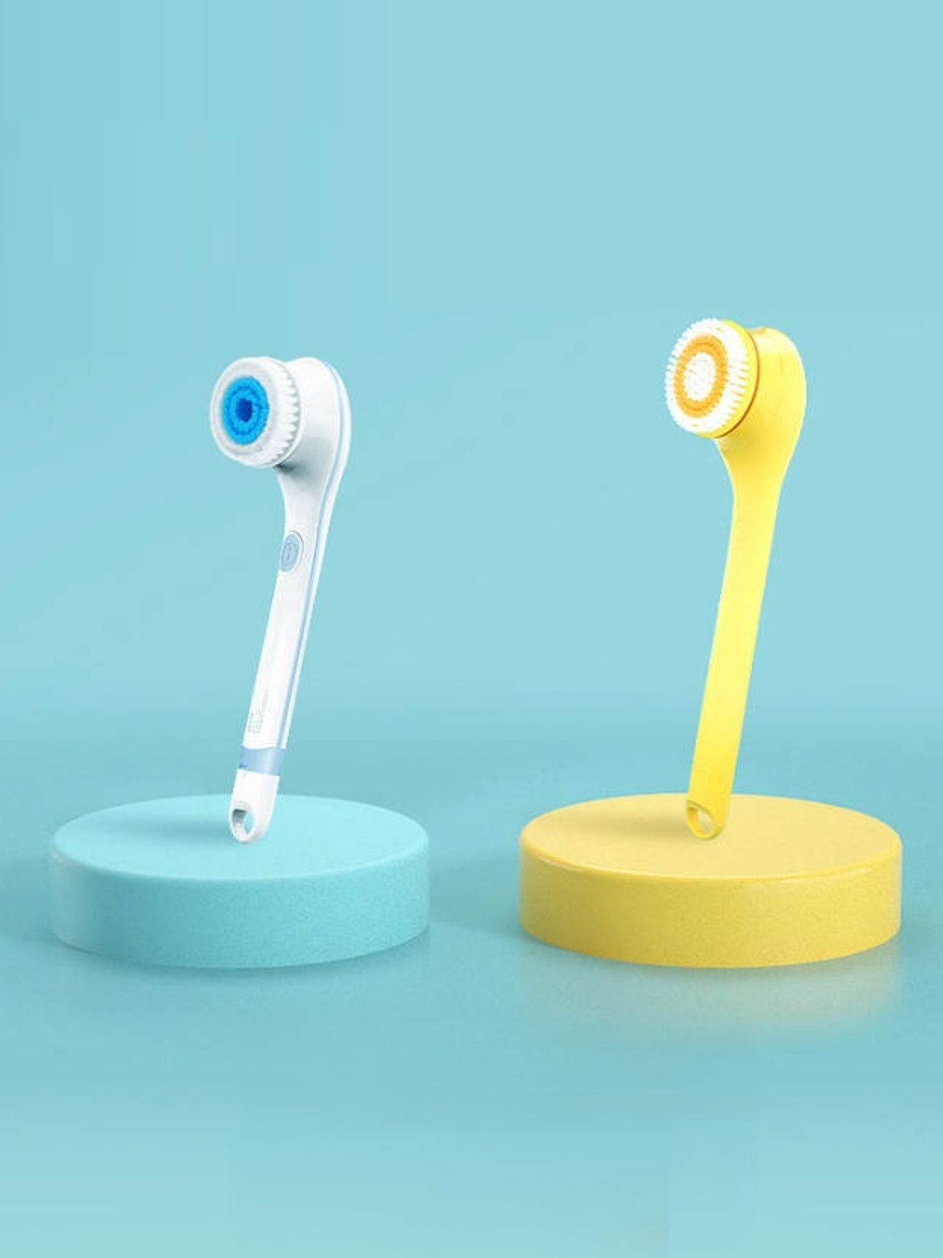 Yellow waterproof electric cleanser brush from Trendsi, featuring a compact design and textured bristles for facial cleansing.