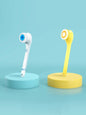 Yellow waterproof electric cleanser brush from Trendsi, featuring a compact design and textured bristles for facial cleansing.