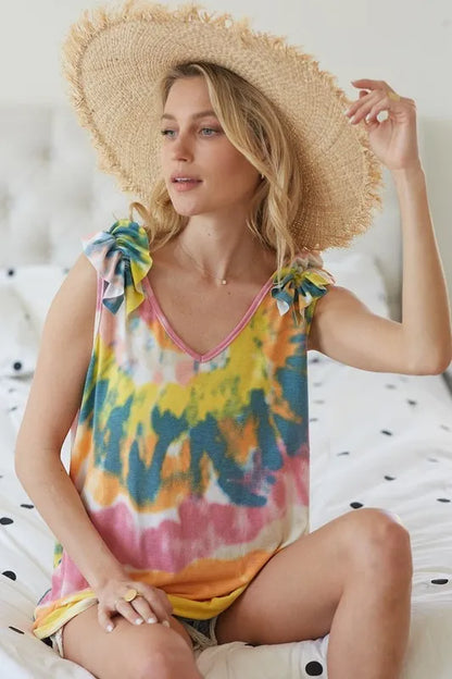 Yellow and orange tie-dye knit V-neck top with ruffle detail, by Trendsi, featuring a circular pattern and stylish design.