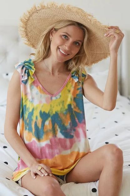 Yellow-orange tie-dye knit V-neck top with ruffles from BiBi Circular by Trendsi, featuring a stylish, relaxed fit and vibrant pattern.