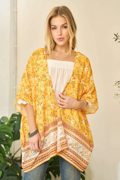 Yellow floral printed Davi & Dani short sleeve kimono cover-up with a loose fit and lightweight fabric for a breezy, stylish look.