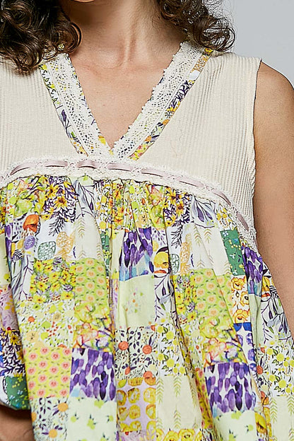 Vanilla cream floral V-neck sheer tank top with lace trim, trendy women's blouse by Trendsi.