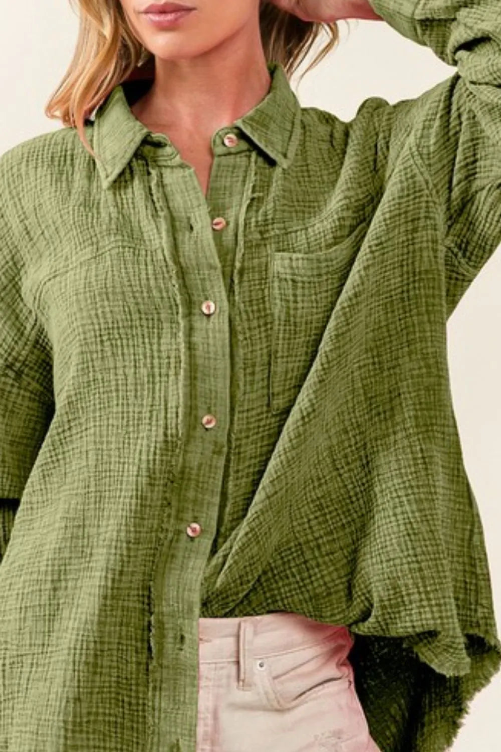 Vintage olive BiBi raw edge mineral washed loose fit shirt showing distressed details and casual relaxed fit.