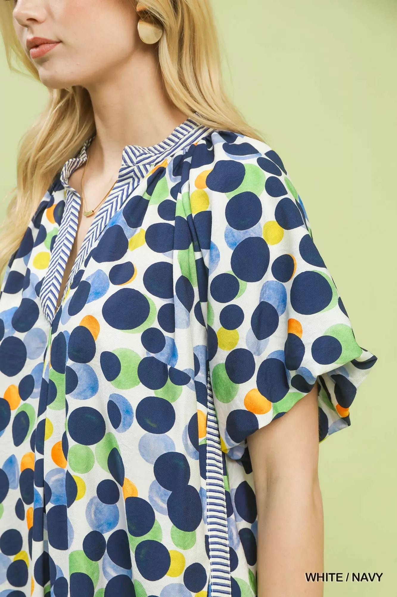 White and navy polka dot print tunic dress by Umgee, featuring a relaxed fit and classic pattern, perfect for casual wear.