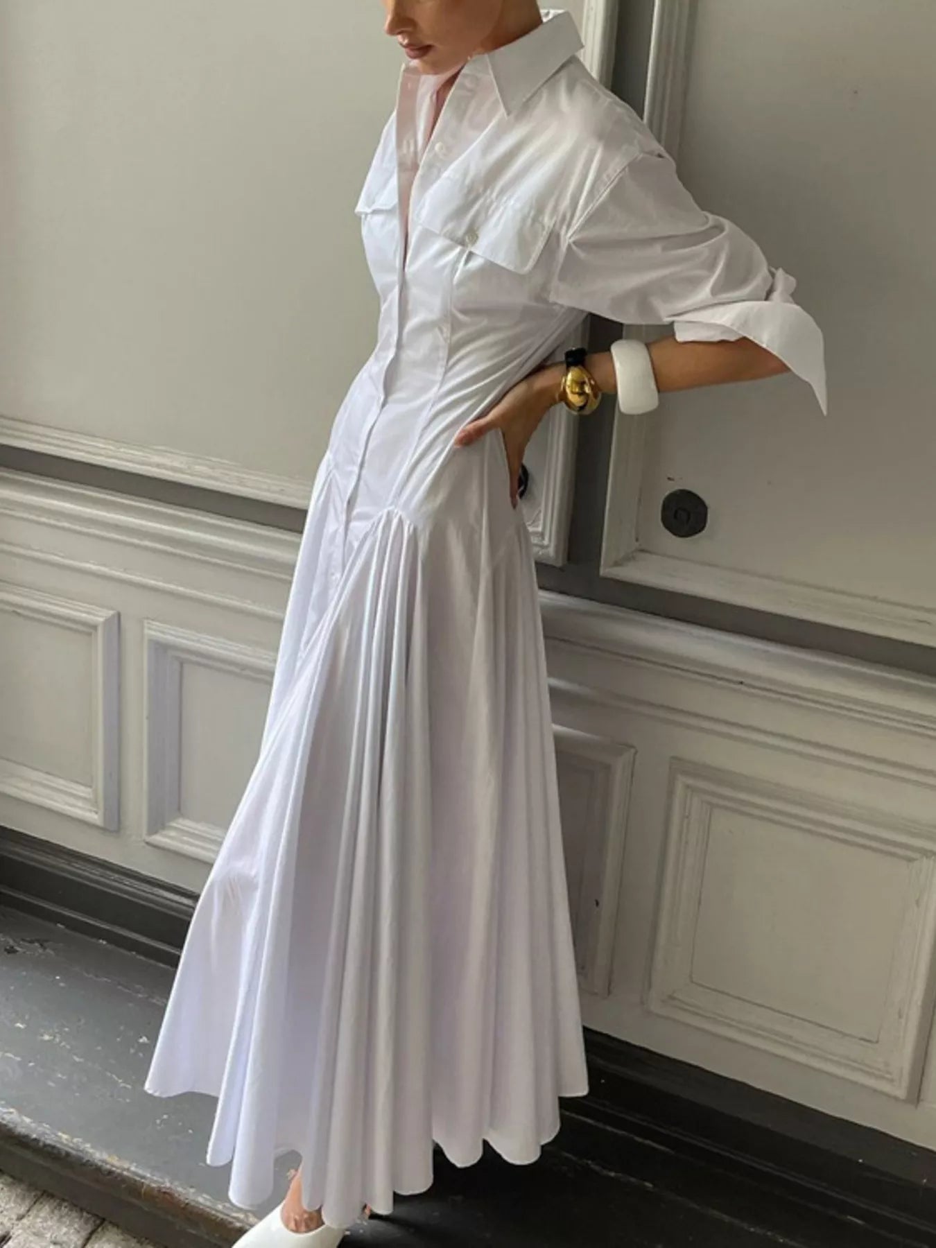 White button-front long sleeve maxi shirt dress by Trendsi, featuring a relaxed fit, collar, and full-length sleeves.