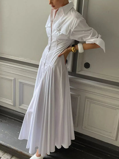 White button-front long sleeve maxi shirt dress by Trendsi, featuring a relaxed fit, collar, and full-length sleeves.