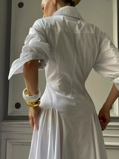 White button-front long sleeve maxi shirt dress by Trendsi, featuring a flowing silhouette and classic collar design.