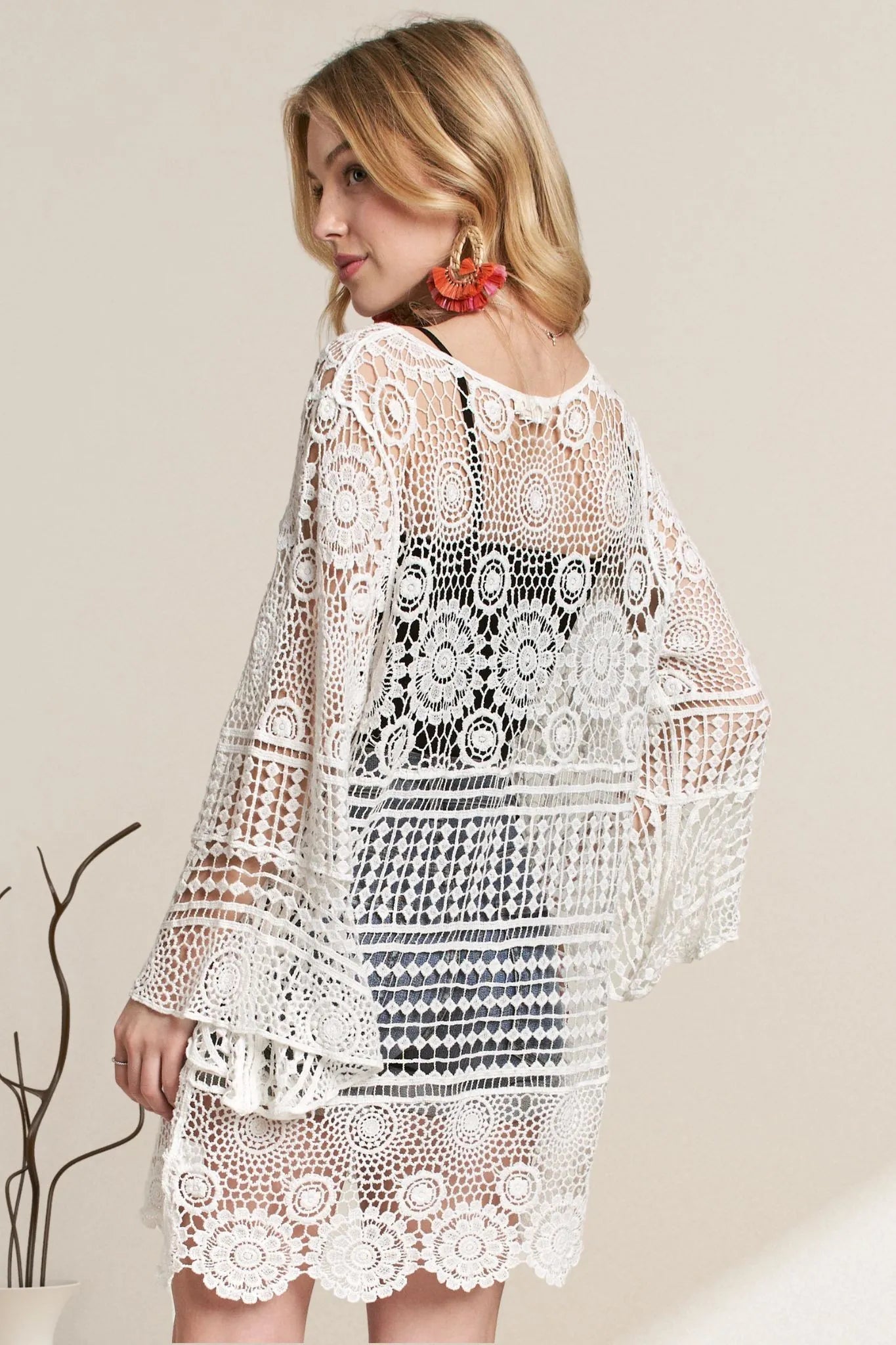 White ADORA front lace-up crochet cover-up by Trendsi, lightweight with intricate crochet detailing, perfect for beachwear.